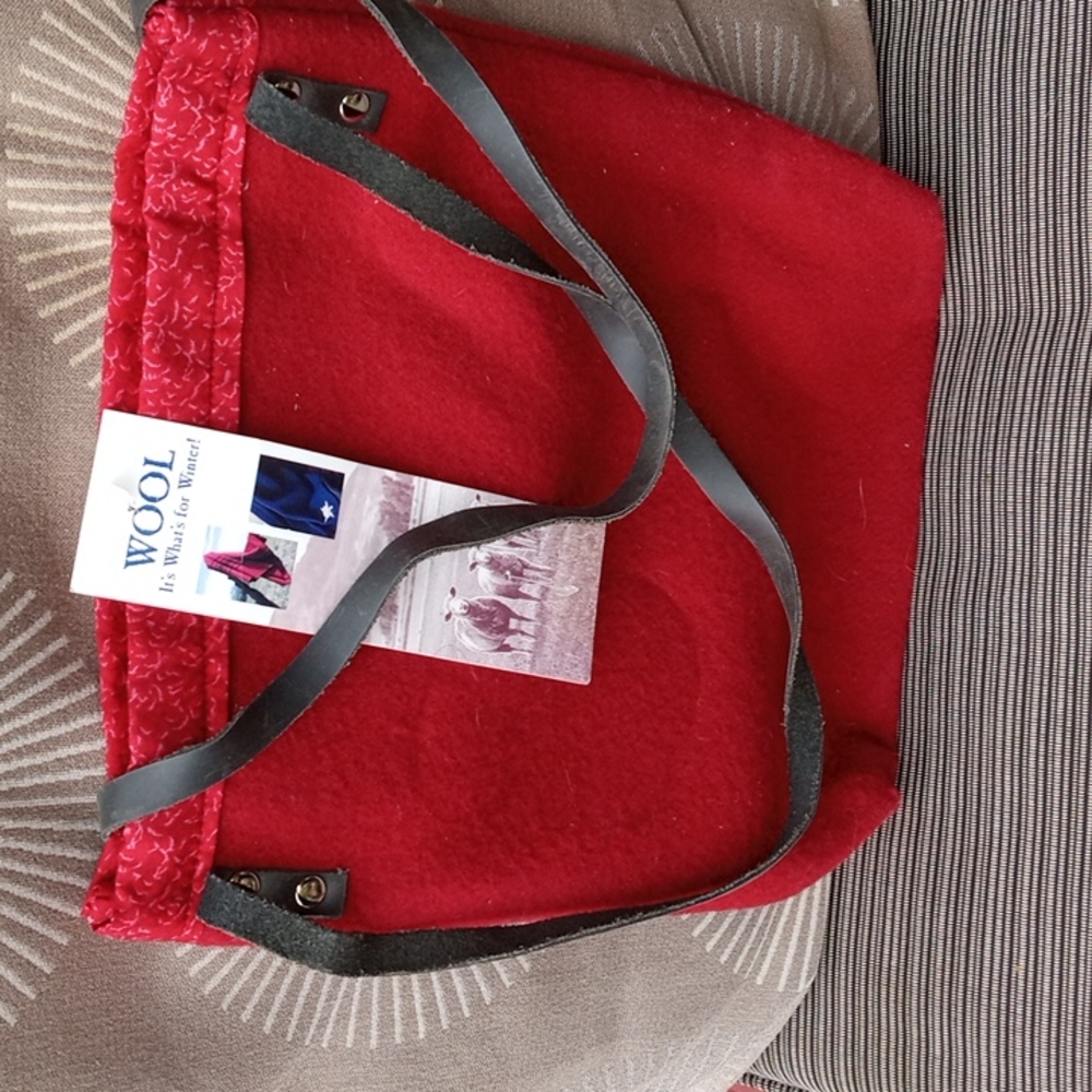 Red wool reversalable 9 by 11". Made in steamboat springs CO like new